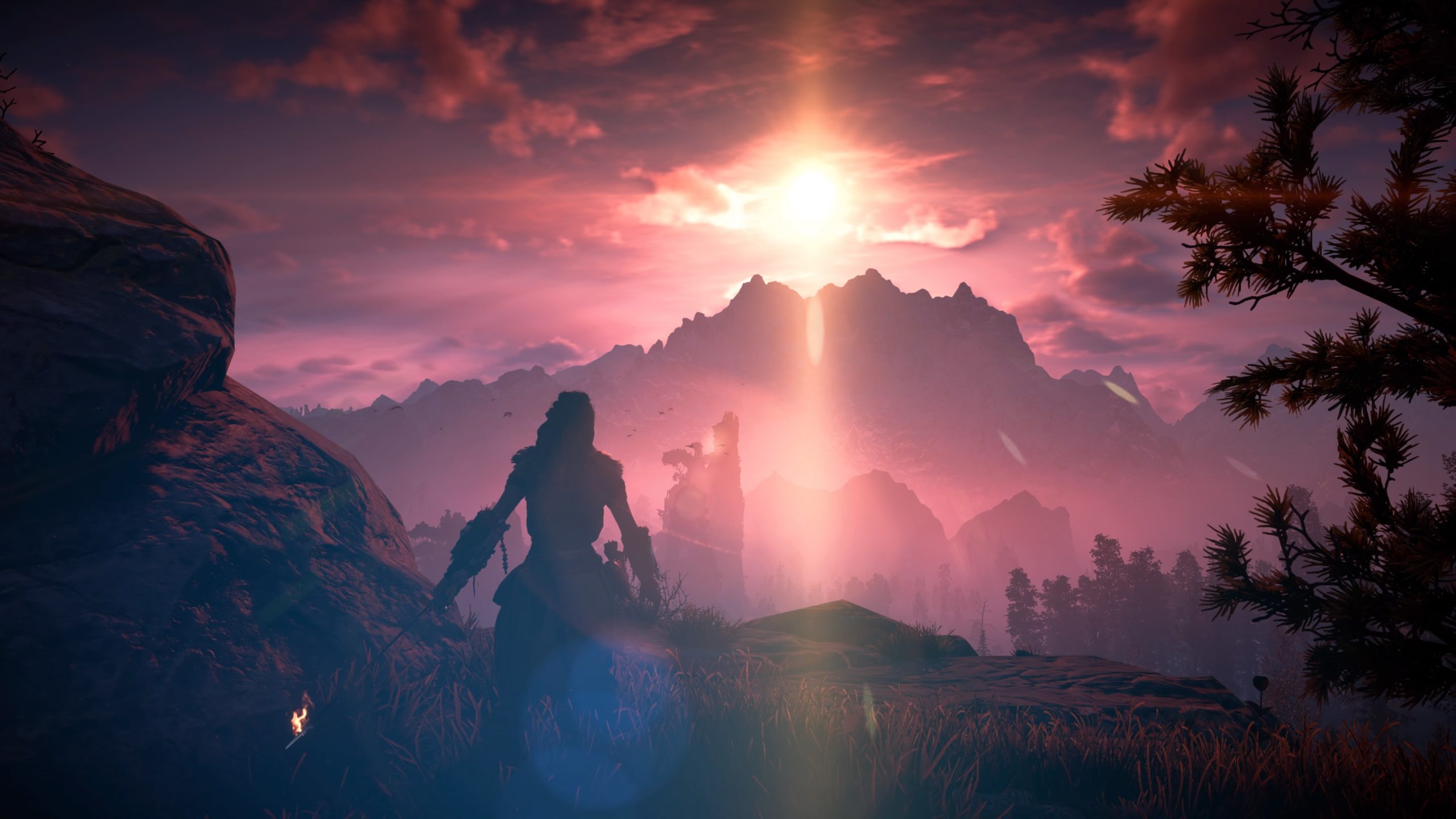 Aloy watching beautiful sun above mountains